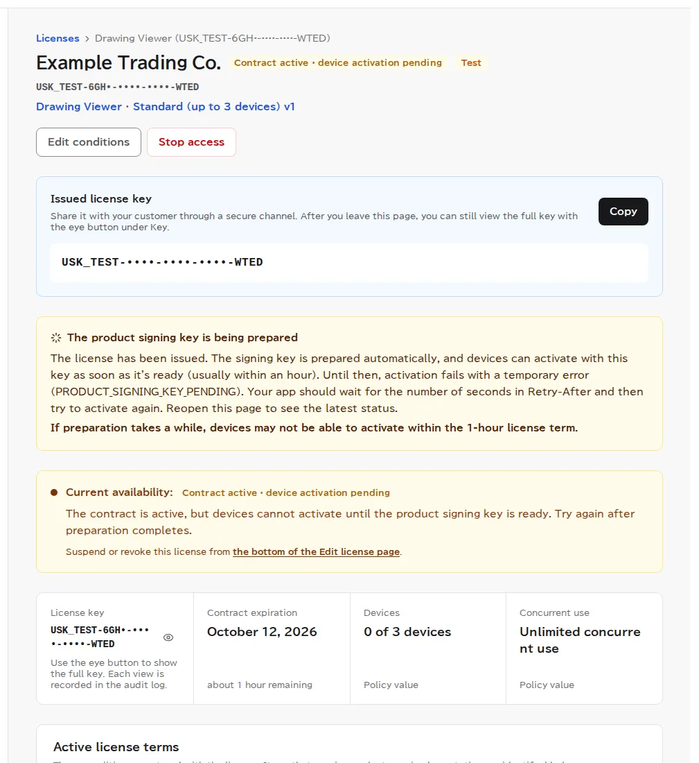 The issued license's page, showing the issued license key (all but the last 4 characters masked in this image) with a copy button, a notice that the product signing key is being prepared, and the current access status as Active.
