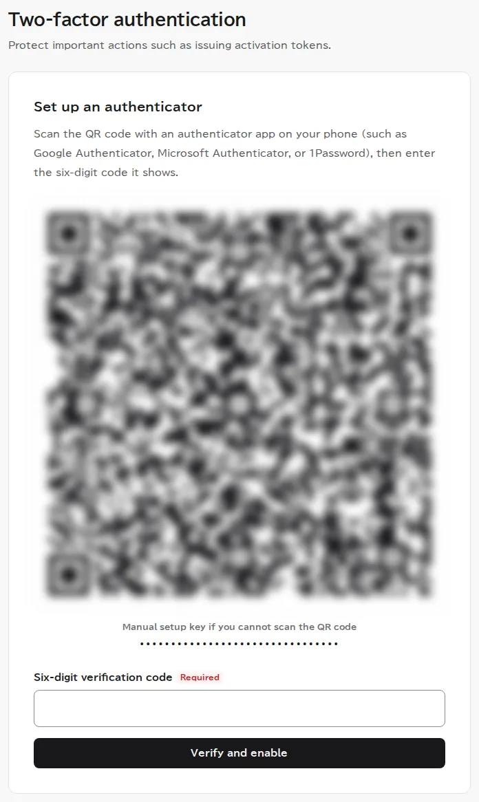 The setup page after choosing an authenticator app, with instructions to register an authenticator, the QR code (blurred in this image), the manual setup key (masked in this image), and a field for the 6-digit code.